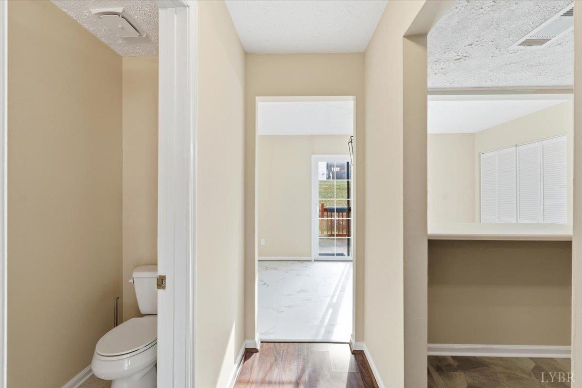 154 Kitty Hawk Square Lynchburg, VA 24502 - Photo 8 of 30 a white toilet sitting next to a bathroom sink