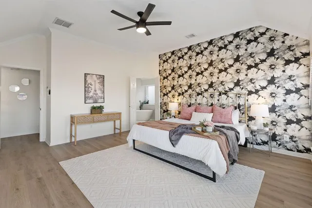 a bedroom with bed and a night stand