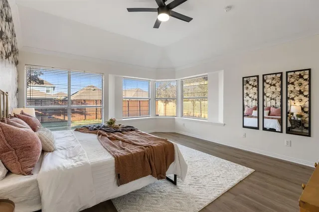 a spacious bedroom with a bed a window and walk in closet