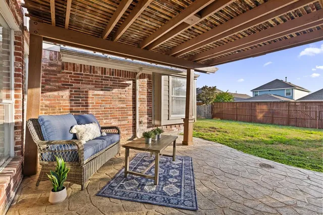 a living room with furniture and a garden
