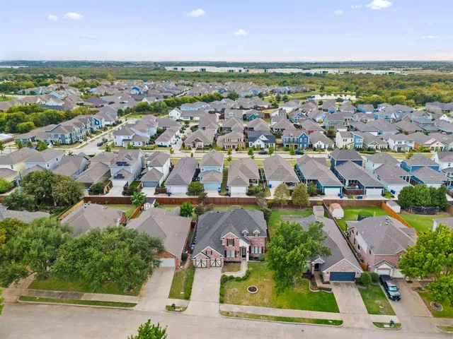 an aerial view of residential houses and outdoor space