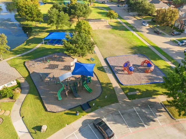 an aerial view of residential houses with outdoor space