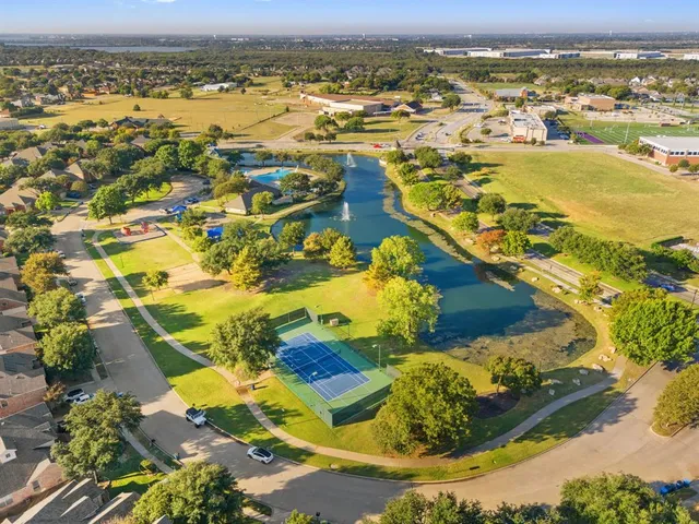 an aerial view of residential houses with outdoor space