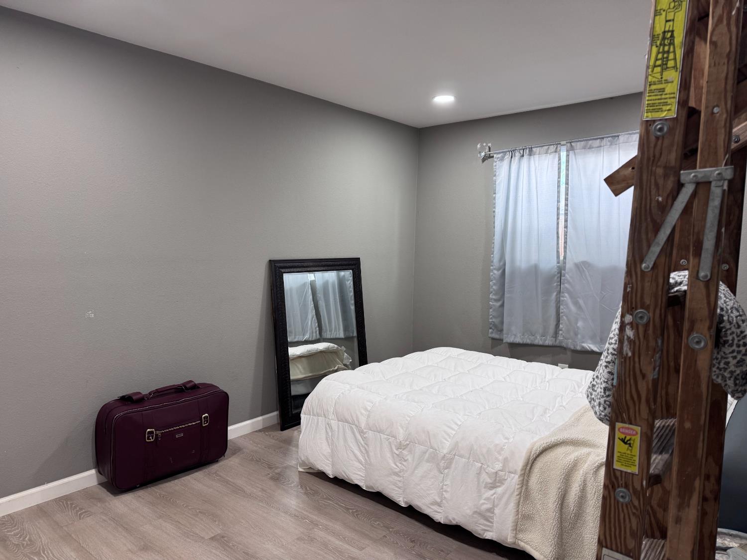 250 Davis Street Turlock, CA 95380 - Photo 3 of 18 Spacious bedroom in the 1 bedroom unit. Laminate flooring throughout