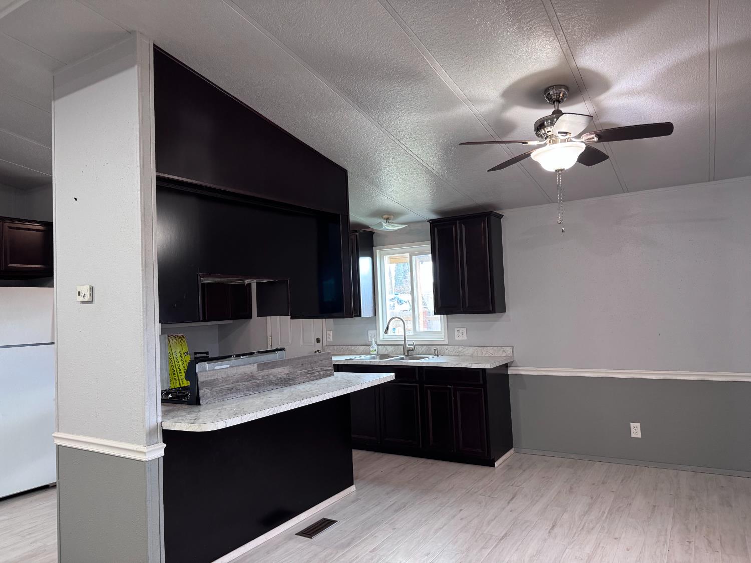 250 Davis Street Turlock, CA 95380 - Photo 9 of 18 Ceiling Fan, laminate floors
