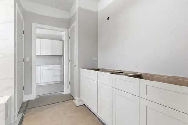 a view of cabinets and closet