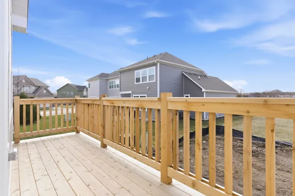 a front view of a house with wooden fence