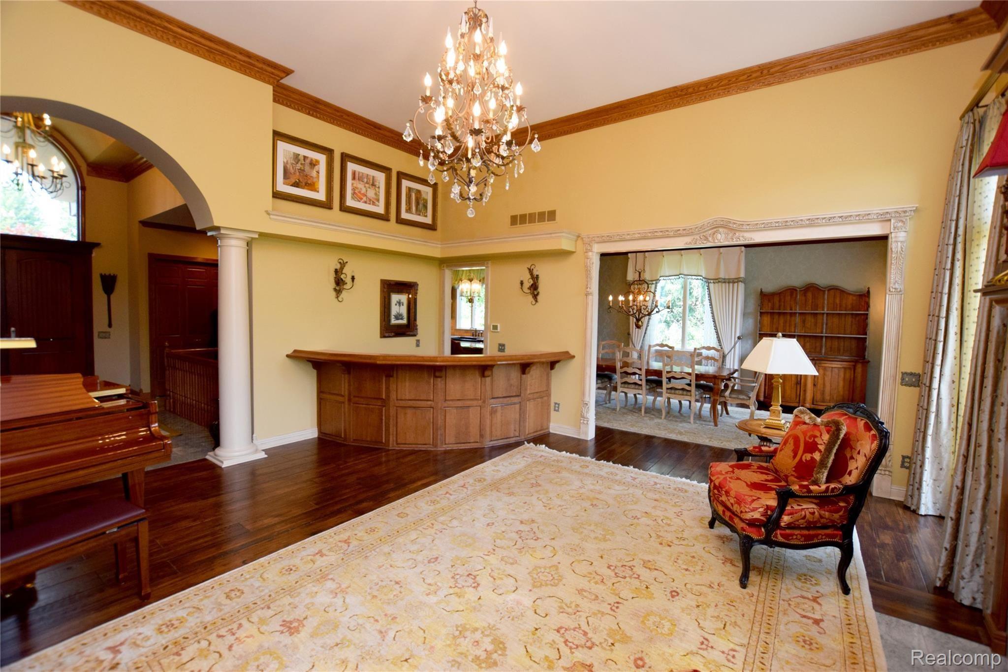 11471 Sharp Road Linden, MI 48451 - Photo 9 of 38 Great Room with Wet Bar - note magnificent archways
