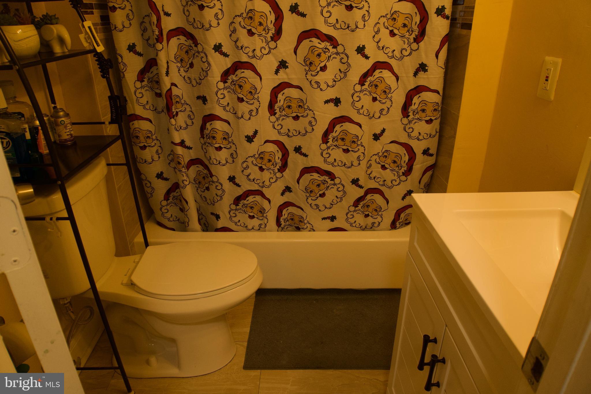 5702 Landover Road Hyattsville, MD 20784 - Photo 12 of 18 a bathroom with a toilet and a sink