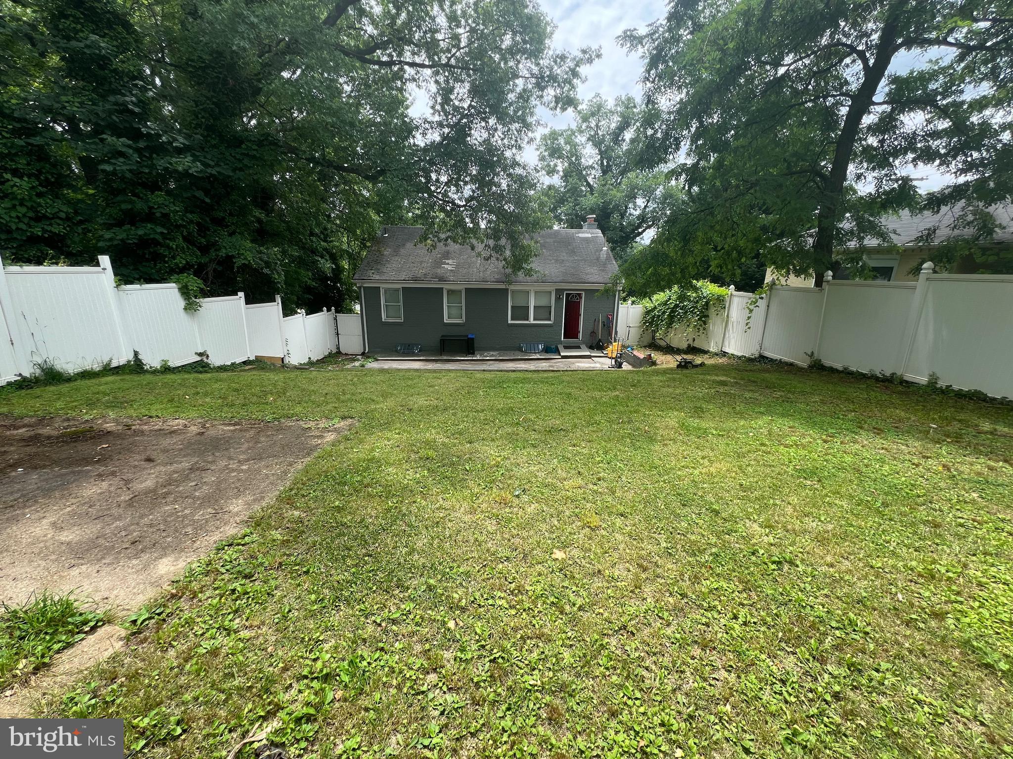 5702 Landover Road Hyattsville, MD 20784 - Photo 18 of 18 a yellow house in middle of the forest