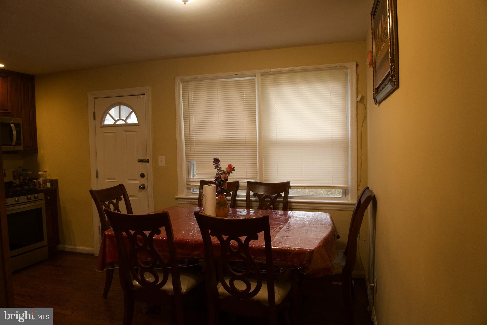 5702 Landover Road Hyattsville, MD 20784 - Photo 4 of 18 a view of a dining room with furniture and window