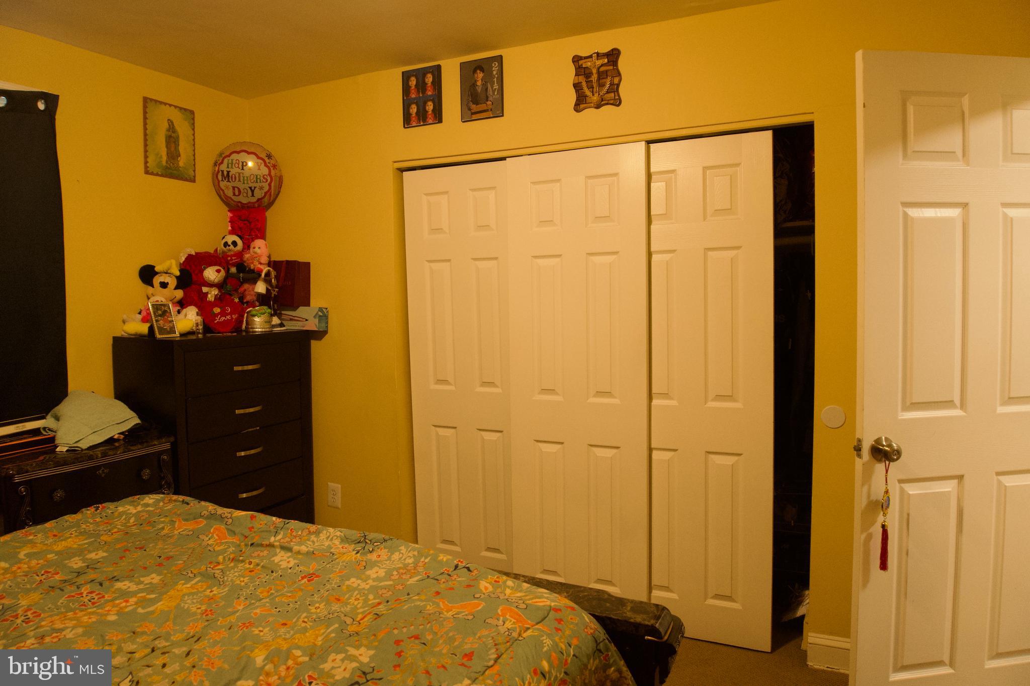 5702 Landover Road Hyattsville, MD 20784 - Photo 8 of 18 a bedroom with a bed and a closet