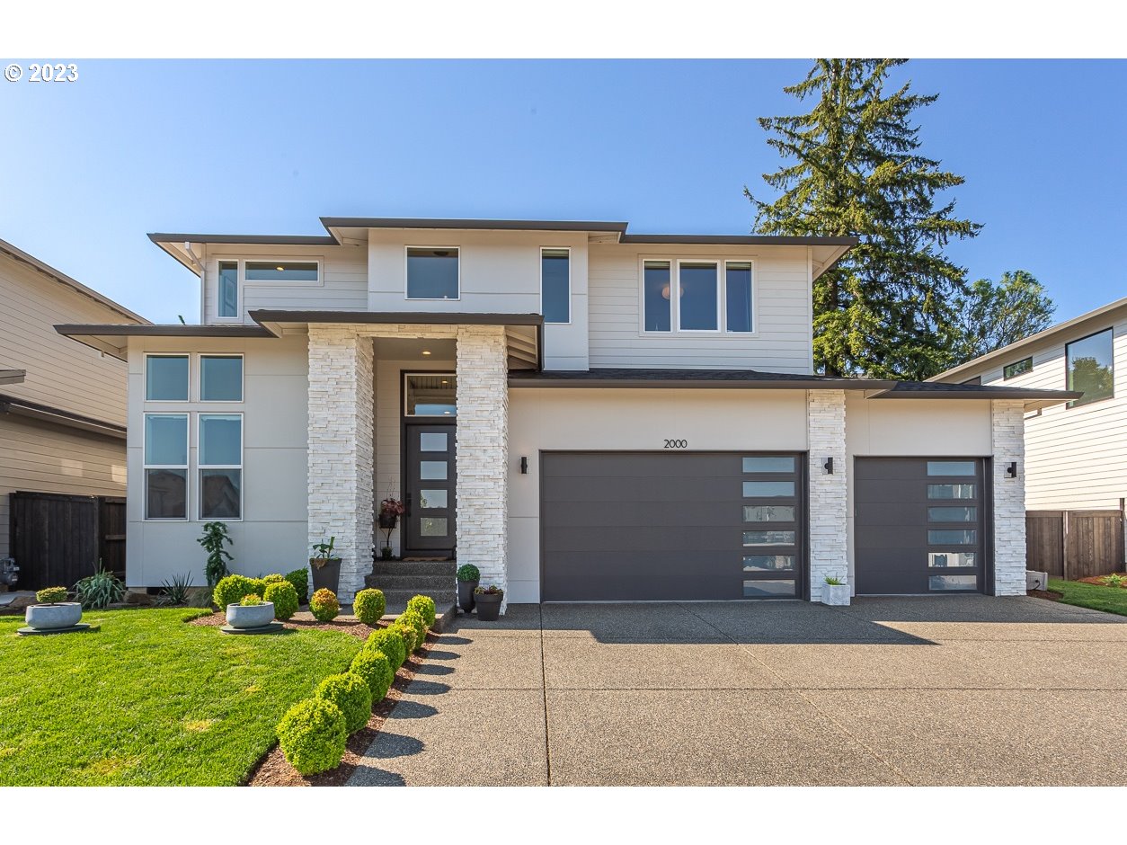 2000 Northwest 33rd Way Camas, WA 98607 - Photo 1 of 48 a front view of a house with a garden