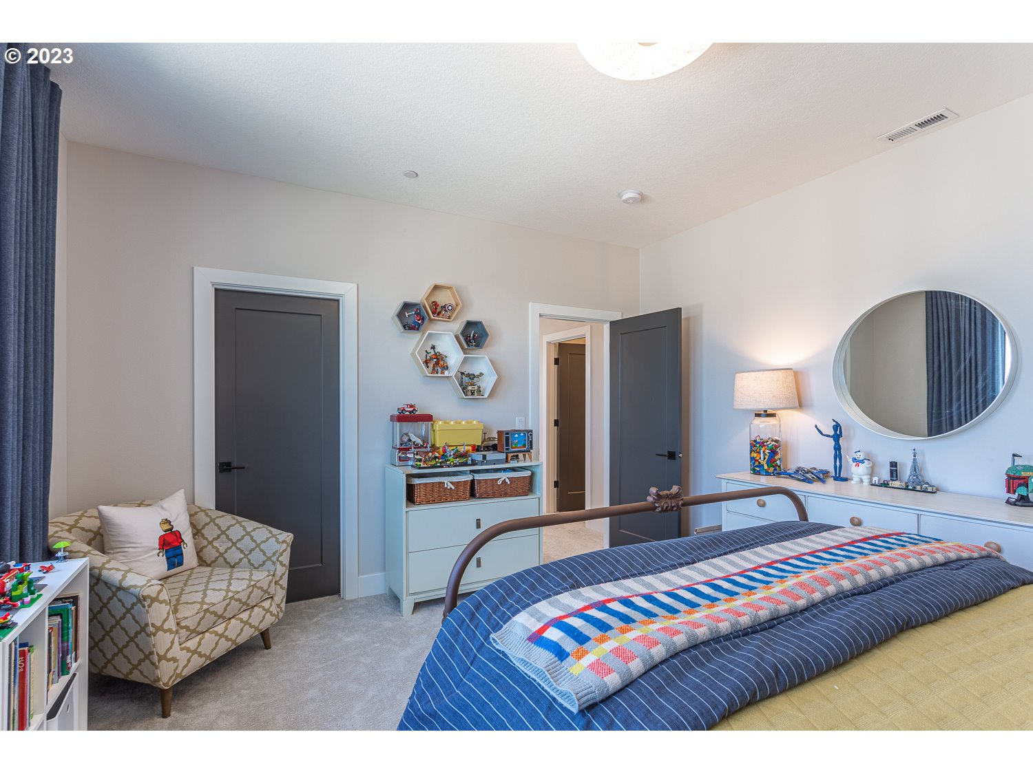2000 Northwest 33rd Way Camas, WA 98607 - Photo 39 of 48 a bedroom with a bed and a chandelier