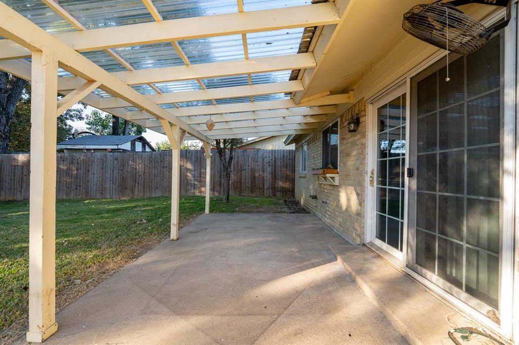 2713 Springlake Court Irving, TX 75060 - Photo 12 of 14 a view of a backyard with plants and a patio