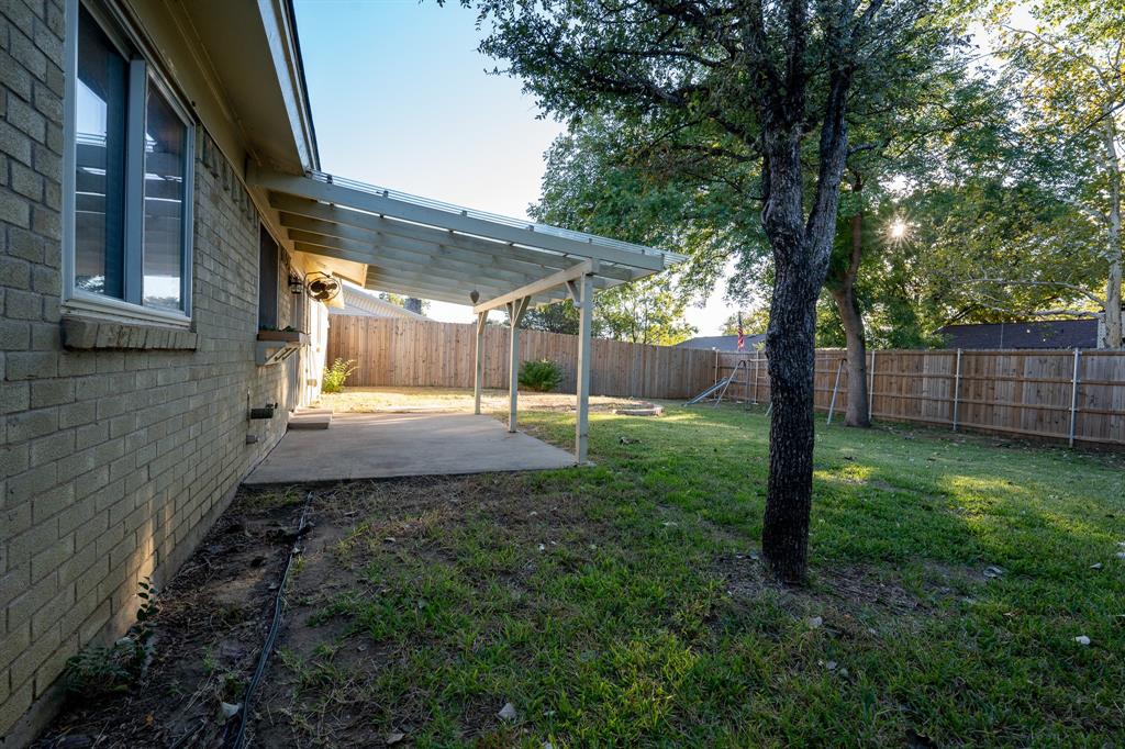 2713 Springlake Court Irving, TX 75060 - Photo 13 of 14 a view of a back yard with a house