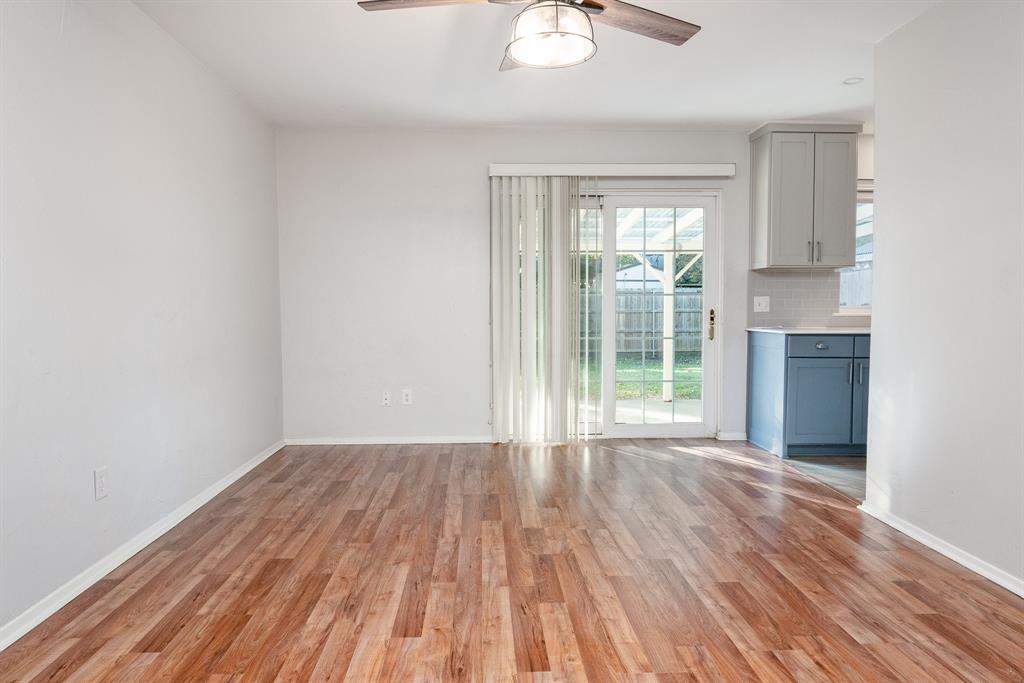 2713 Springlake Court Irving, TX 75060 - Photo 2 of 14 a view of empty room with wooden floor and fan