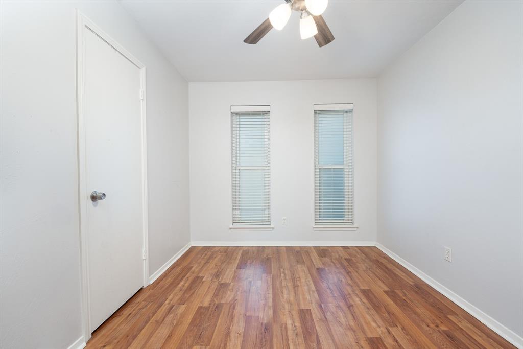 2713 Springlake Court Irving, TX 75060 - Photo 7 of 14 an empty room with a hardwood and ceiling fan