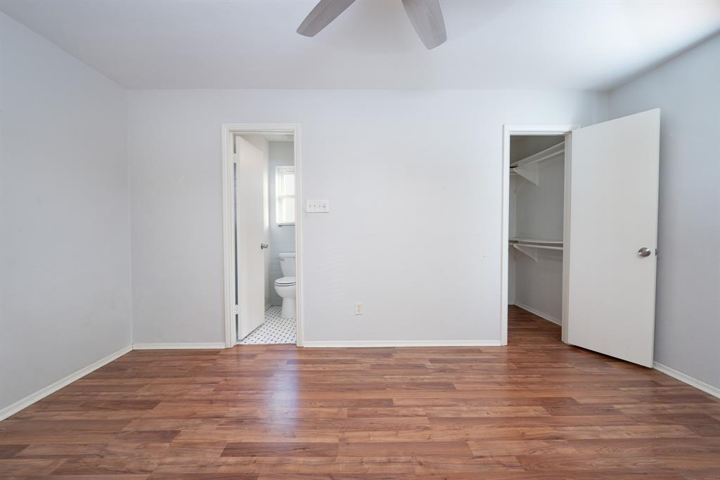 2713 Springlake Court Irving, TX 75060 - Photo 8 of 14 a view of an empty room with wooden floor and closet