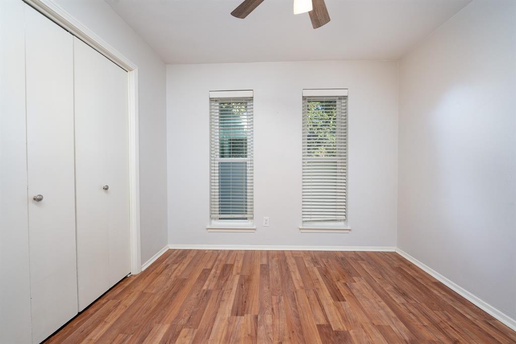 2713 Springlake Court Irving, TX 75060 - Photo 10 of 14 a view of an empty room with wooden floor and a window
