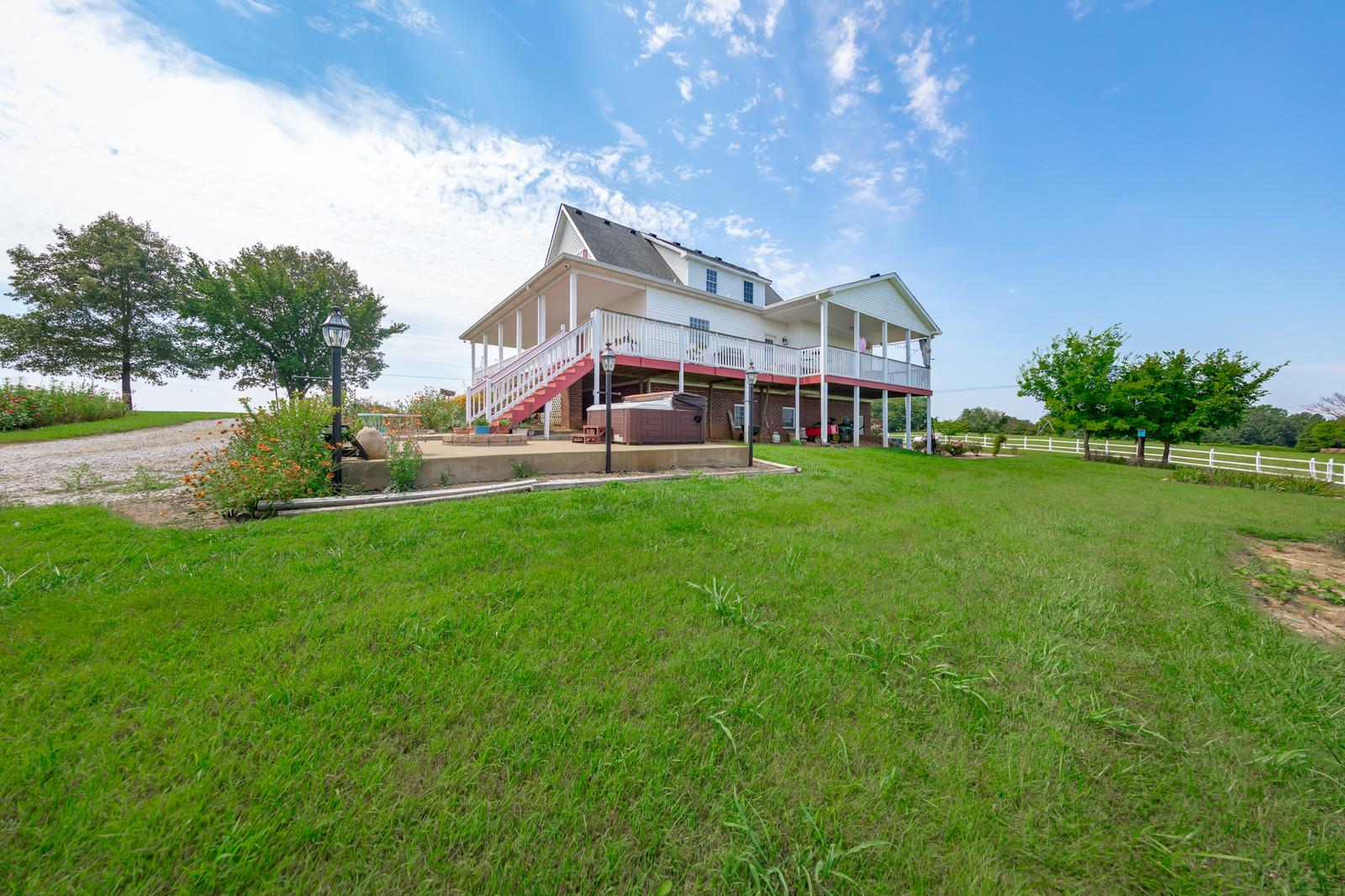 641 7 Mile Ferry Road Cunningham, TN 37052 - Photo 3 of 12 a front view of house with yard and green space