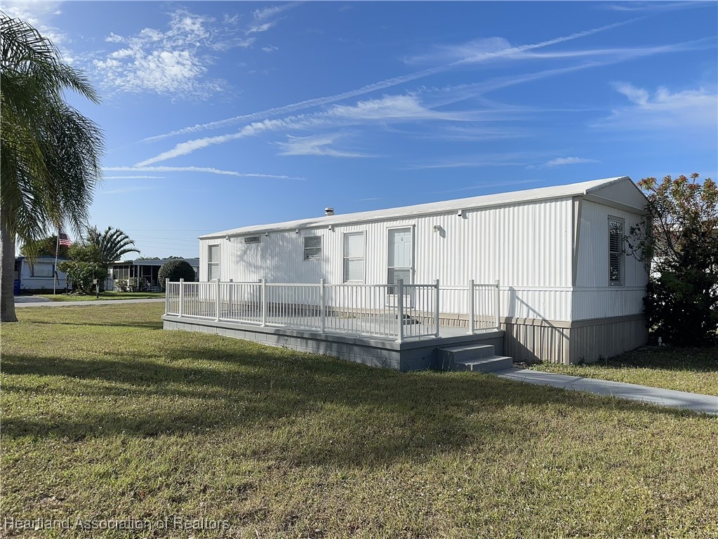 2273 Kansas Street Sebring, FL 33870 - Photo 1 of 10 a view of a backyard with garden