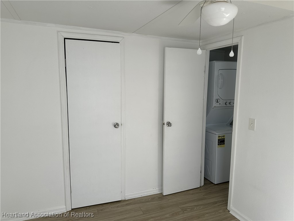 2273 Kansas Street Sebring, FL 33870 - Photo 7 of 10 a view of a hallway with wooden floor