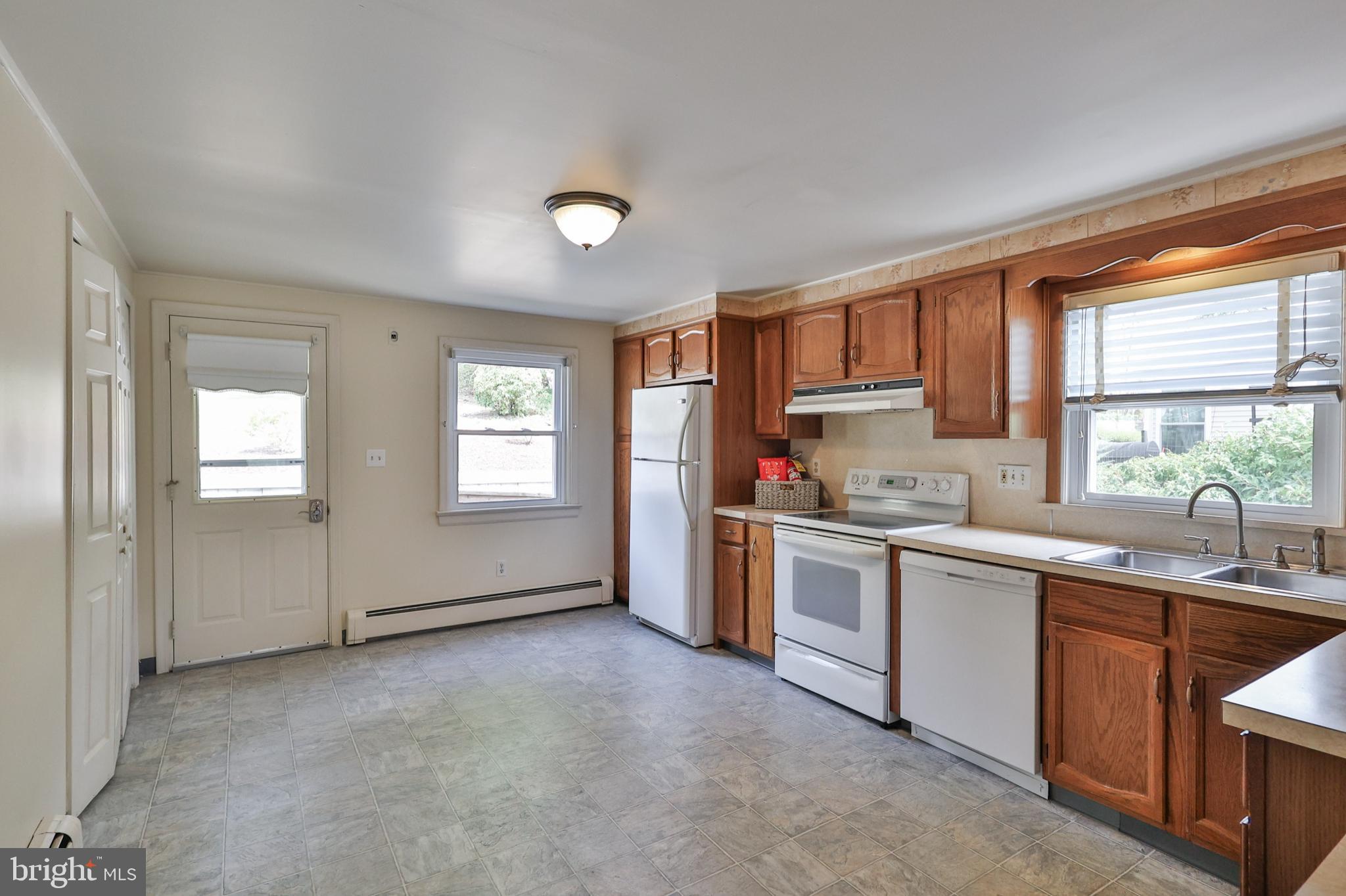 769 Lafayette Avenue Palmerton, PA 18071 - Photo 11 of 46 a kitchen with a sink cabinets appliances and a window