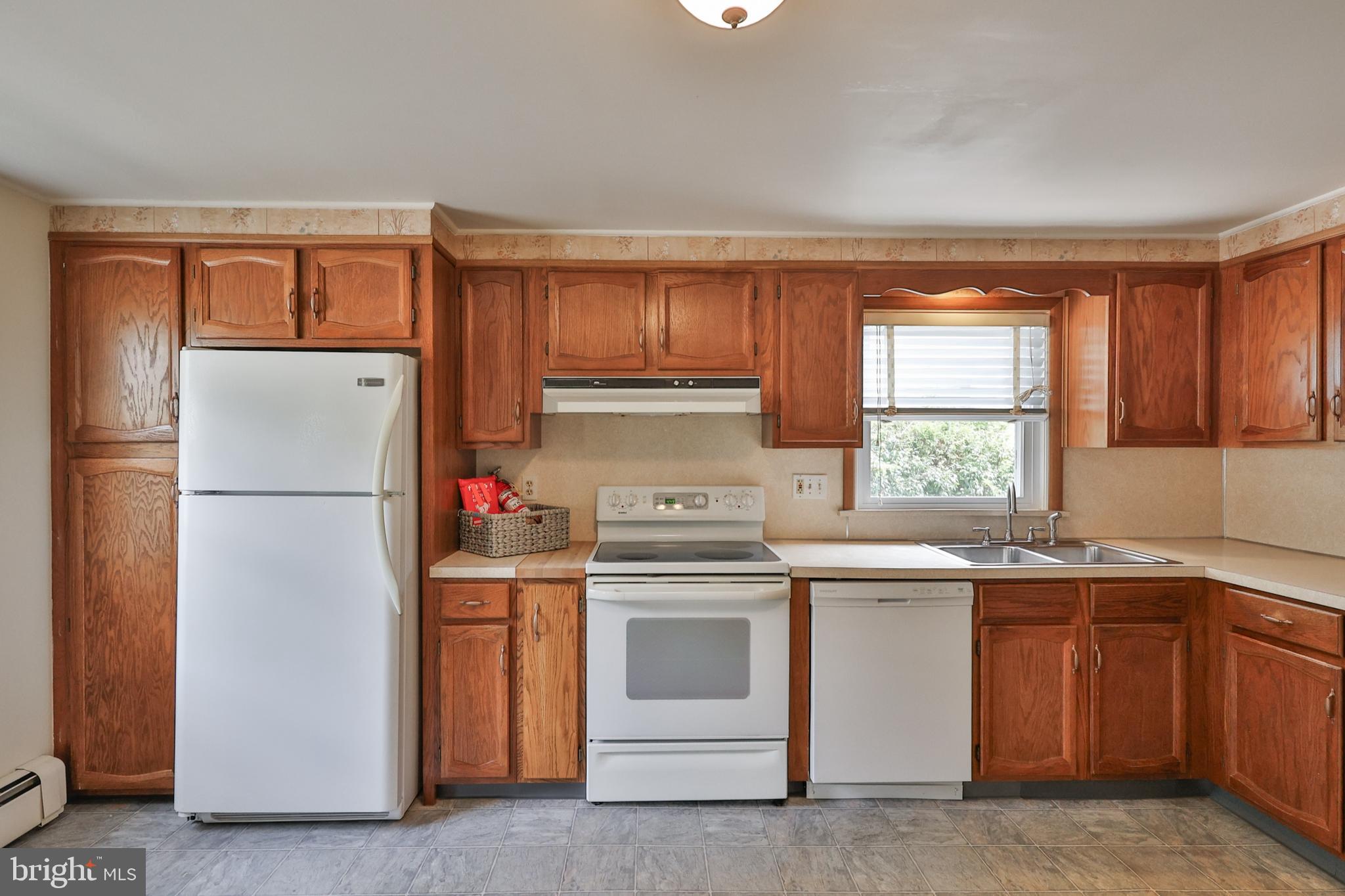 769 Lafayette Avenue Palmerton, PA 18071 - Photo 12 of 46 a kitchen with a stove sink and refrigerator