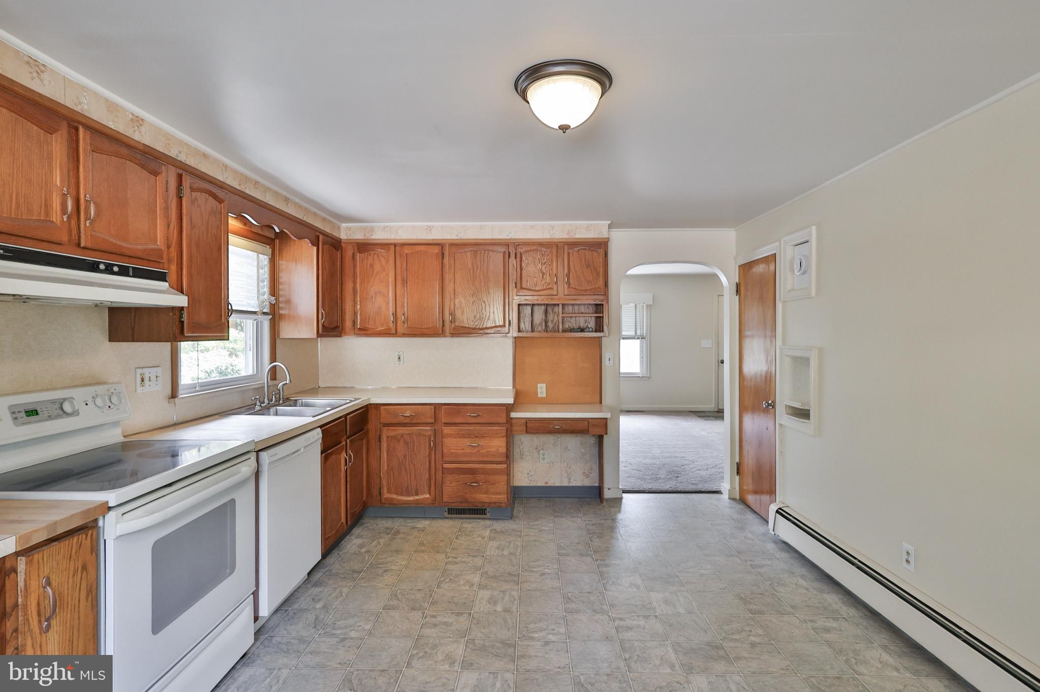 769 Lafayette Avenue Palmerton, PA 18071 - Photo 14 of 46 a kitchen with granite countertop a sink stove and refrigerator