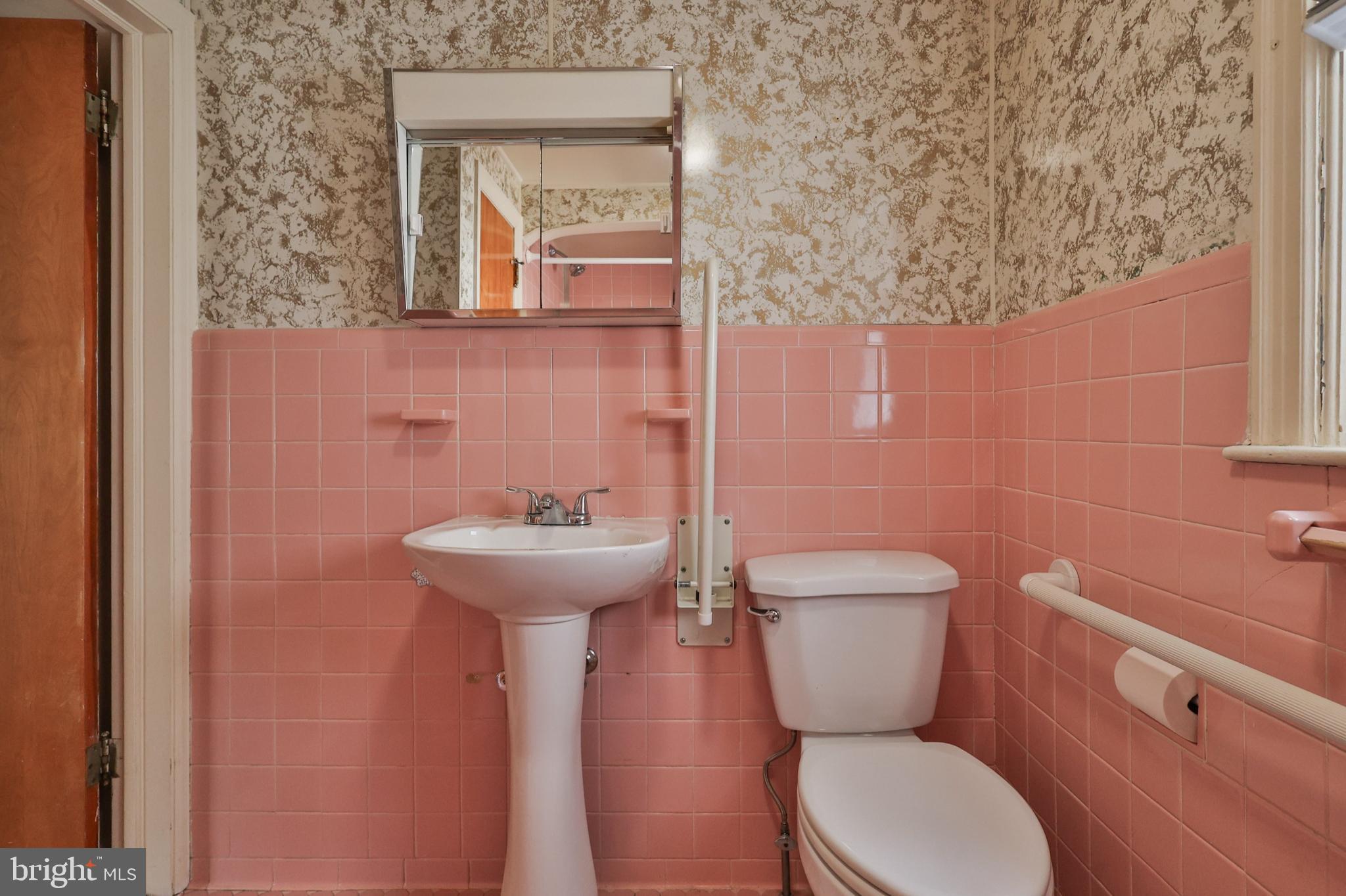 769 Lafayette Avenue Palmerton, PA 18071 - Photo 22 of 46 a bathroom with a toilet a sink and mirror