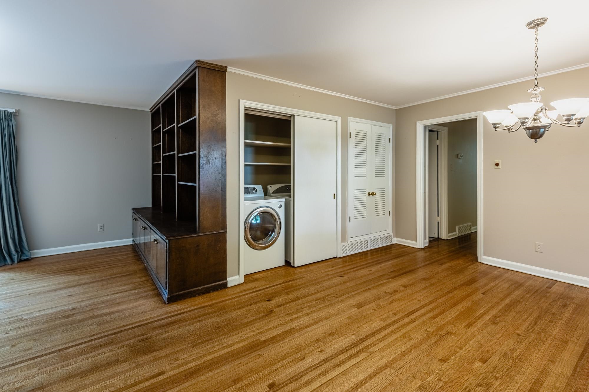1081 Ivy Road Memphis, TN 38117 - Photo 2 of 25 a view of empty room with wooden floor and window