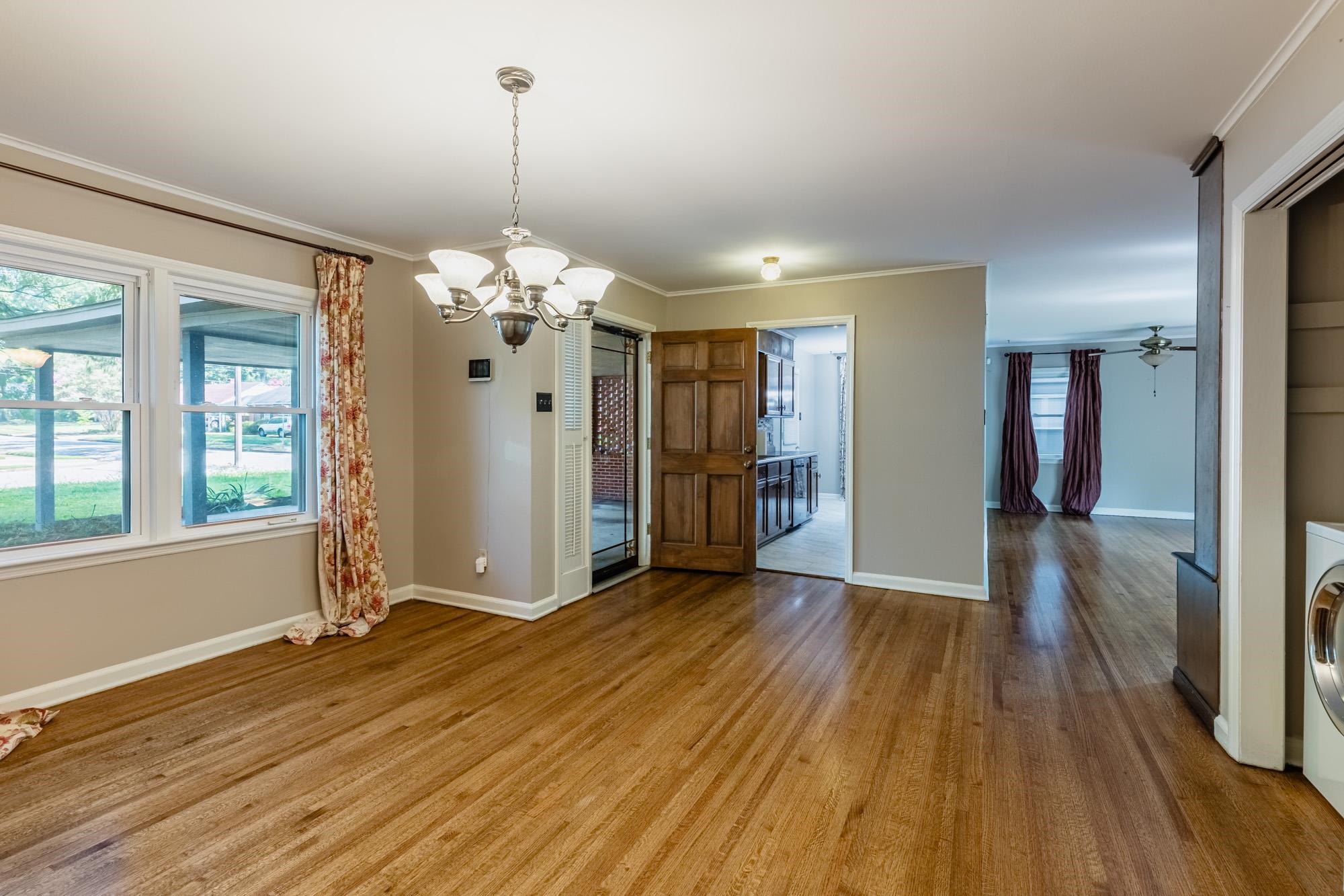 1081 Ivy Road Memphis, TN 38117 - Photo 4 of 25 a view of a room with wooden floor and window