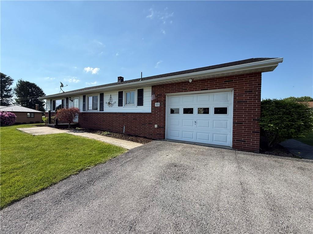 105 Ridgeview Drive Salix, PA 15952 - Photo 2 of 25 a front view of a house with a yard and garage