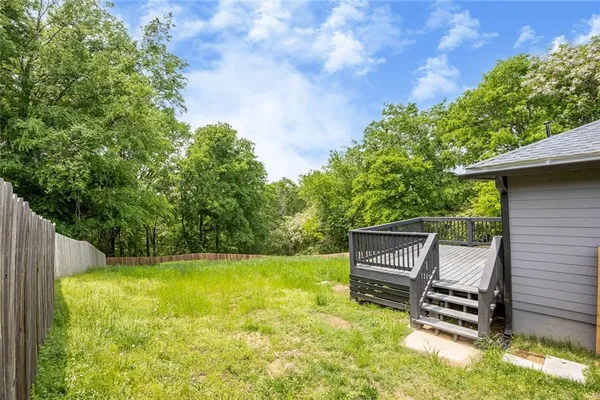 a view of a bench in the backyard