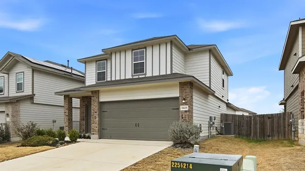 a front view of a house with garage