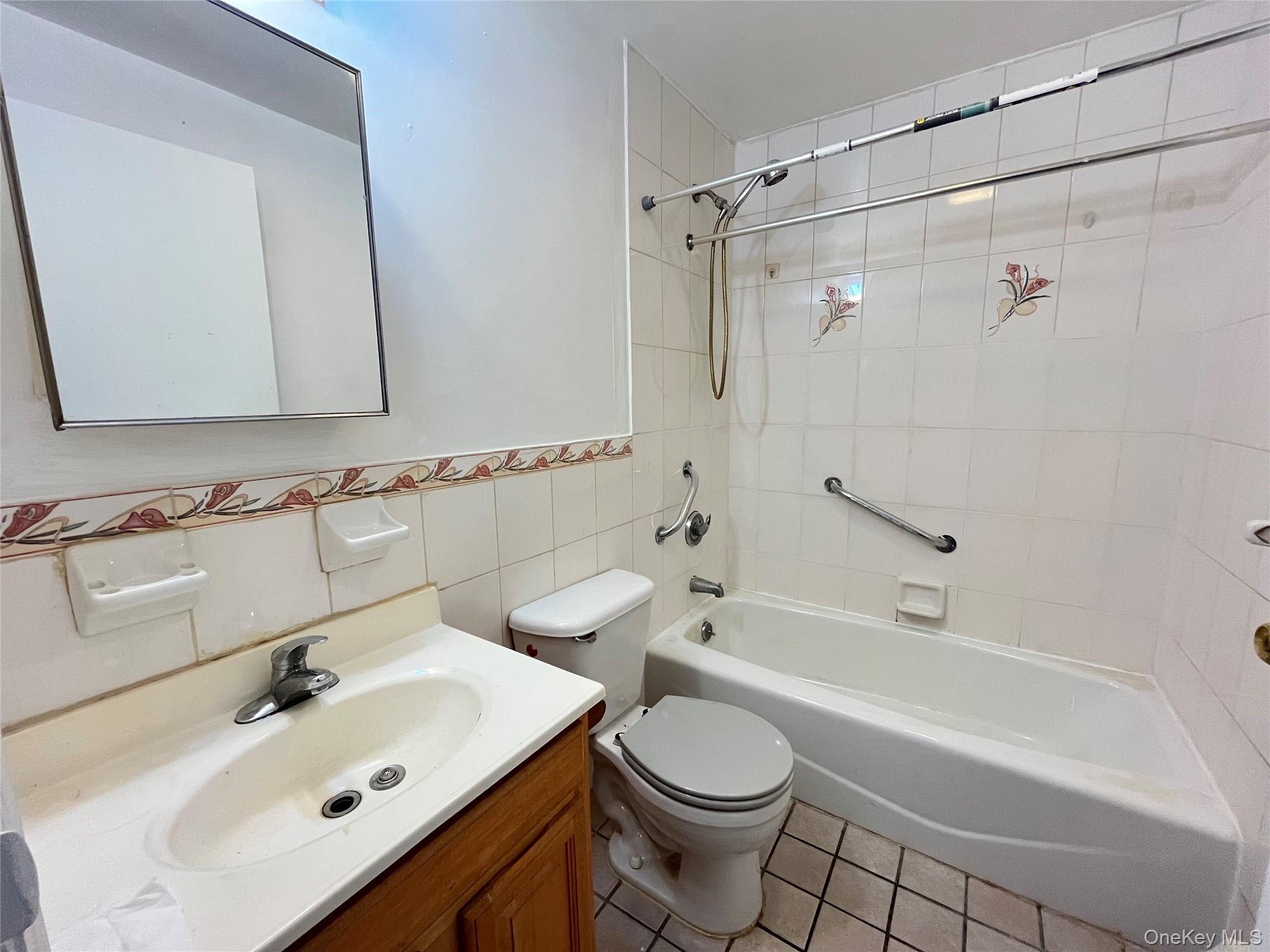 133-38 Avery Avenue, Unit 3FB Queens, NY 11355 - Photo 5 of 8 a bathroom with a sink toilet and shower