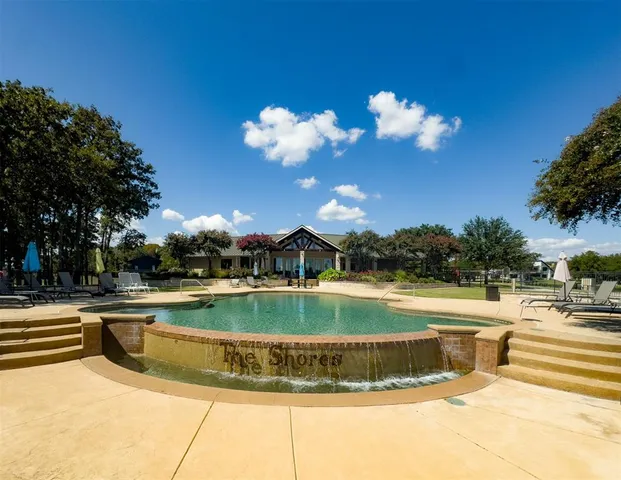a view of a swimming pool with an outdoor space