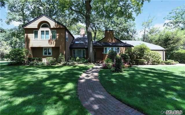 143 Round Hill Road Roslyn Heights, NY 11577 - Photo 1 of 1 a front view of a house with a yard