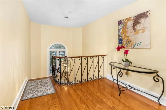 a view of a hallway with a flower pot