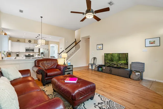 a living room with furniture and a flat screen tv