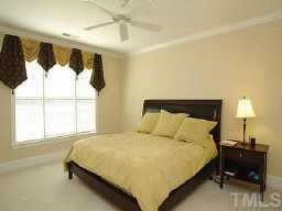 3701 Baron Cooper Pass, Unit 203 Raleigh, NC 27612 - Photo 7 of 10 Luxury Master Bedroom with walk-in closet and attached Master Bathroom. Takes up nearly a third of the CONDO! Walk-in Closet includes built-in shelving for convenient organization!