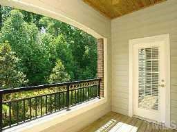 3701 Baron Cooper Pass, Unit 203 Raleigh, NC 27612 - Photo 10 of 10 Arched wooded porch with an intricately designed iron balcony rail. Very private. Enjoy relaxing mornings or evenings overlooking the gorgeous wooded area.