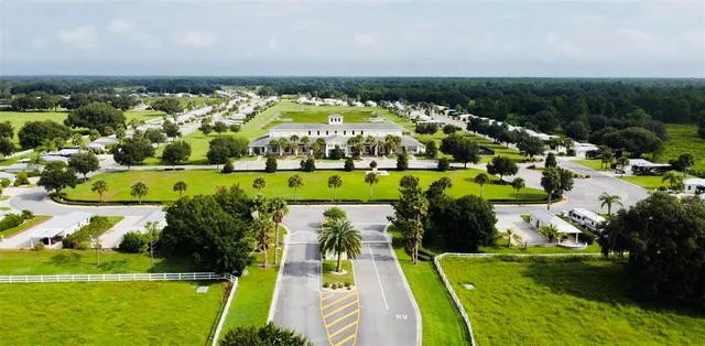 an aerial view of a house with garden space and street view