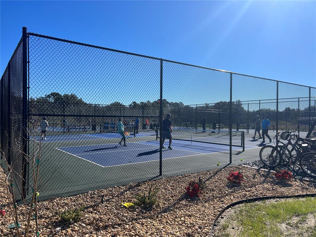 9477 Southeast 49th Terrace Webster, FL 33597 - Photo 25 of 31 a view of a tennis court