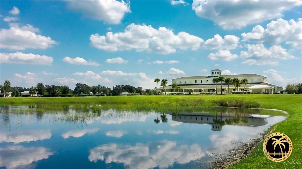 9477 Southeast 49th Terrace Webster, FL 33597 - Photo 27 of 31 a view of a lake with houses in the back