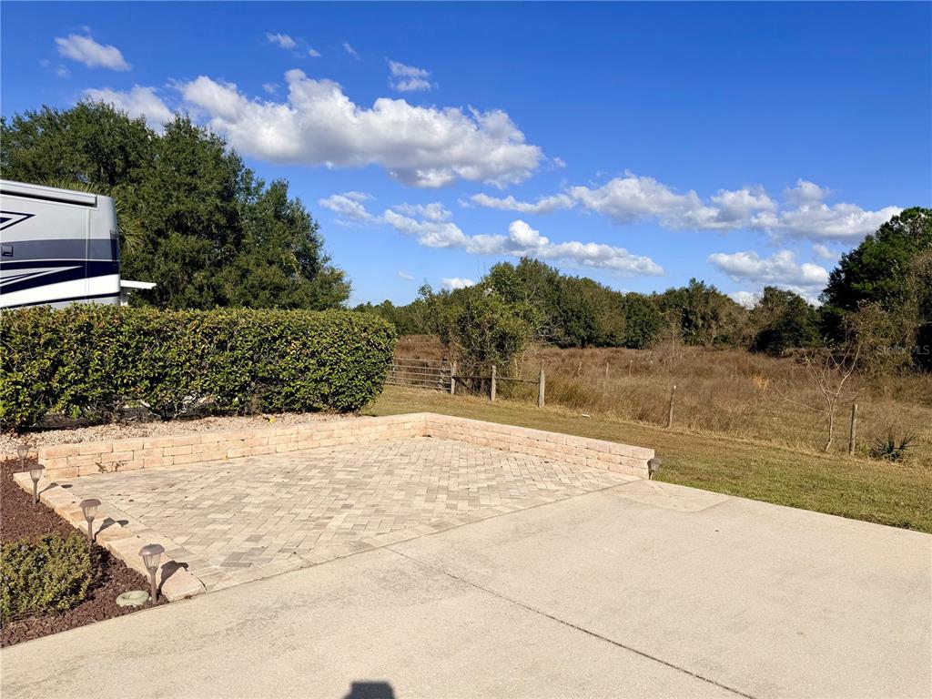 9477 Southeast 49th Terrace Webster, FL 33597 - Photo 6 of 31 a view of swimming pool with a yard