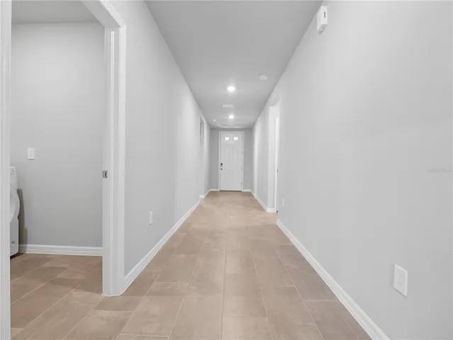 a kitchen with stainless steel appliances a refrigerator stove microwave and cabinets