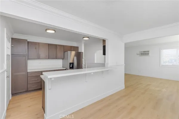 a kitchen with a sink cabinets and stainless steel appliances