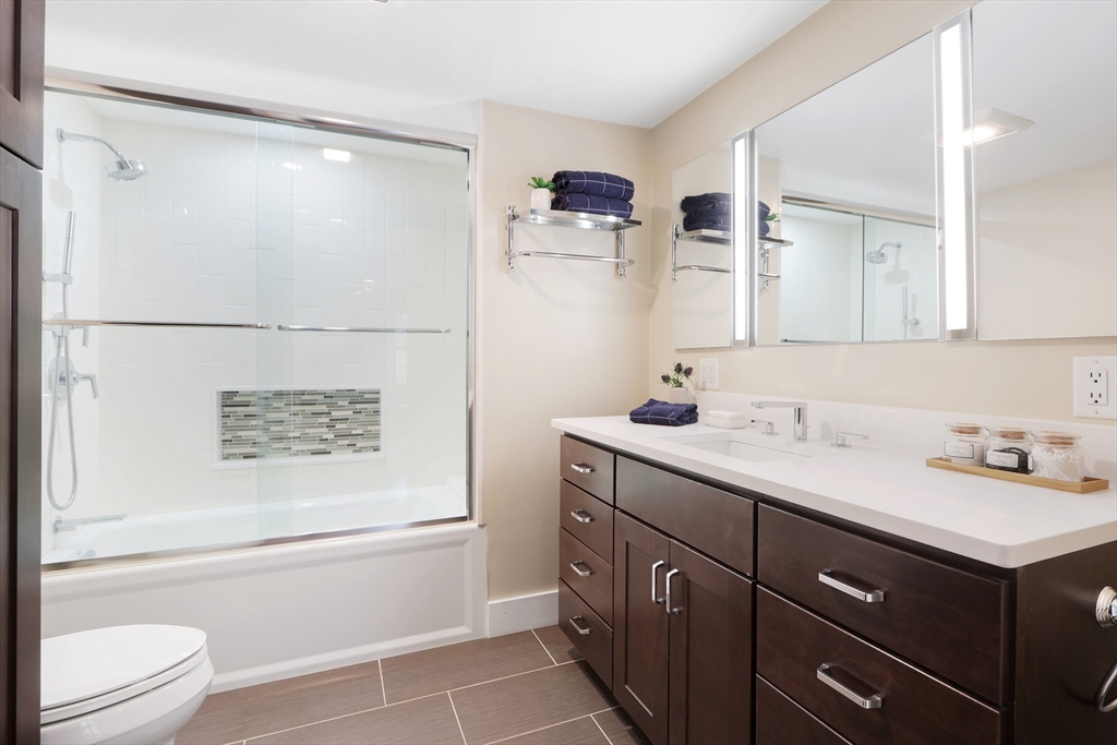 28 Longfellow Road Natick, MA 01760 - Photo 12 of 30 a bathroom with a sink a toilet and shower